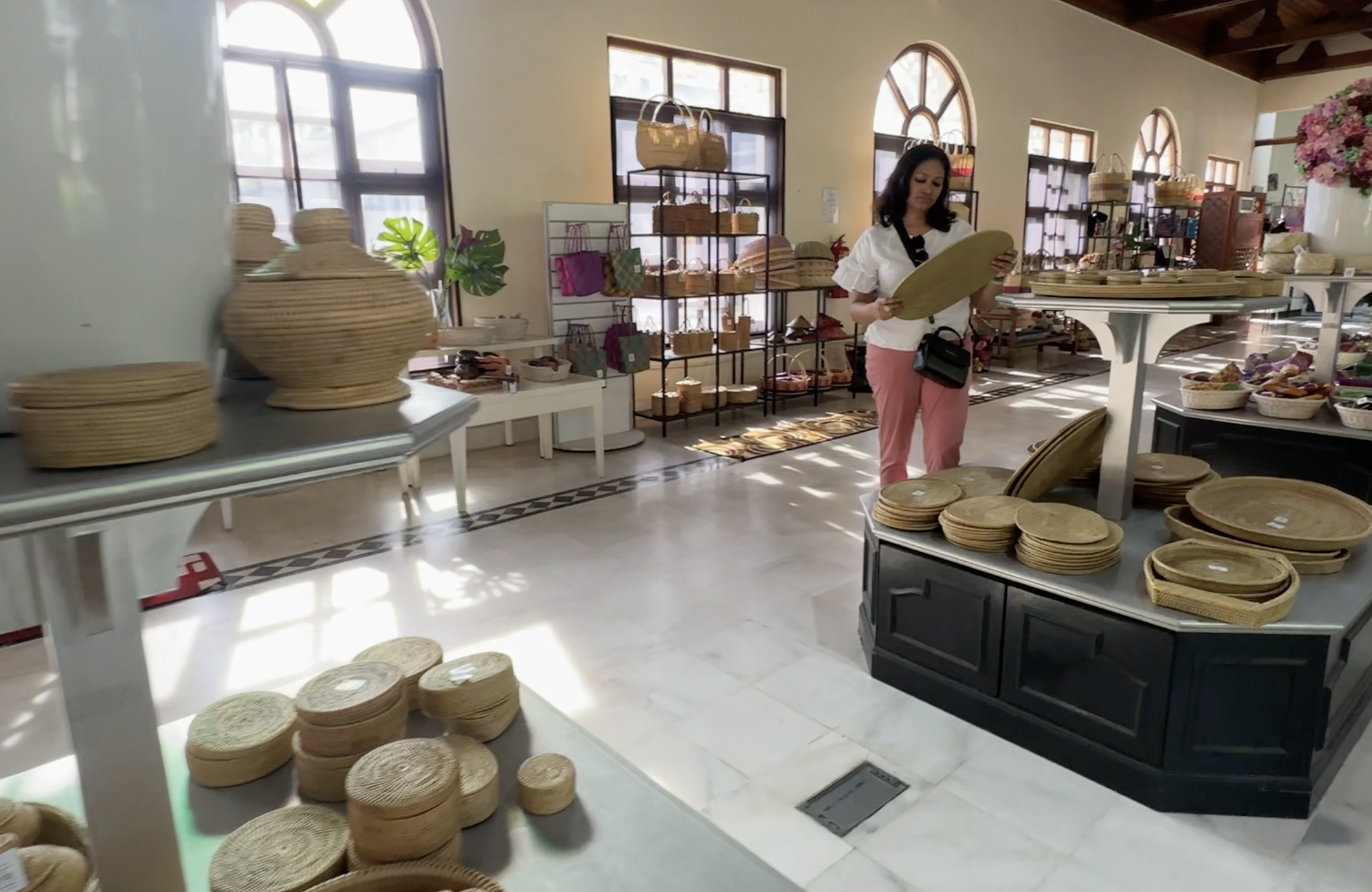 A woman is looking at the local item made in Craft Complex Langkawi.